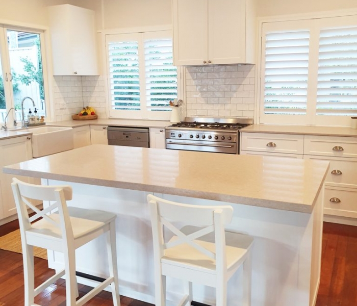 Beautiful white kitchen with Ceaserstone Clambshell Benchtop designed and built by Gecko Kitchens Brisbane