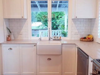 Beautiful white kitchen with Ceaserstone Clambshell Benchtop Beautiful white kitchen with Ceaserstone Clambshell Benchtop designed and built by Gecko Kitchens Brisbane