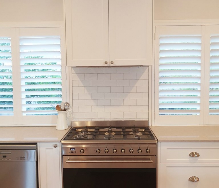 Beautiful white kitchen with Ceaserstone Clambshell Benchtop designed and built by Gecko Kitchens Brisbane