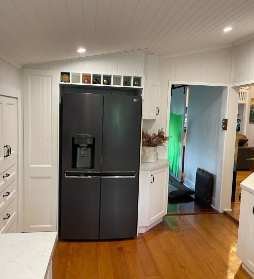 White Kitchen, Wine Rack | Gecko Kitchens, Brisbane White kitchen with black farmers sink, wine rack installed by kitchen builder Gecko Kitchens in Kedron, Brisbane.