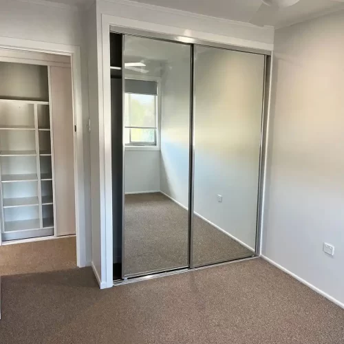Custom built in wardrobes with mirrored sliding doors custom designed and built by Gecko Kitchens, Kedron, Brisbane.