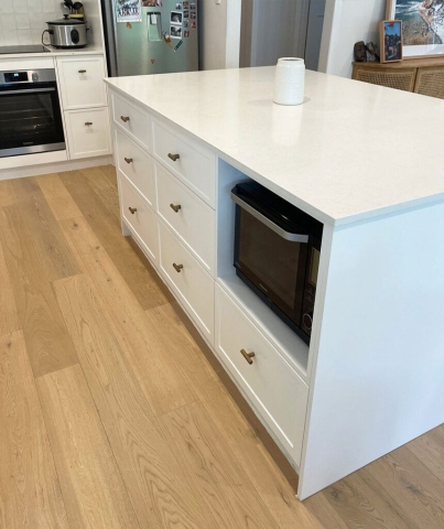Custom kitchen island bench with white cabinetry designed and installed by Gecko Kitchens, kitchen builder. Custom kitchen island bench with white cabinetry designed and installed by Gecko Kitchens, kitchen builder.