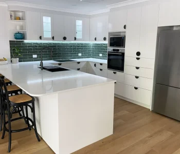 Classic White Sheen Cabinetry & Doors. This kitchen space effortlessly combines elegance and functionality. Built and installed by Gecko Kitchens.
