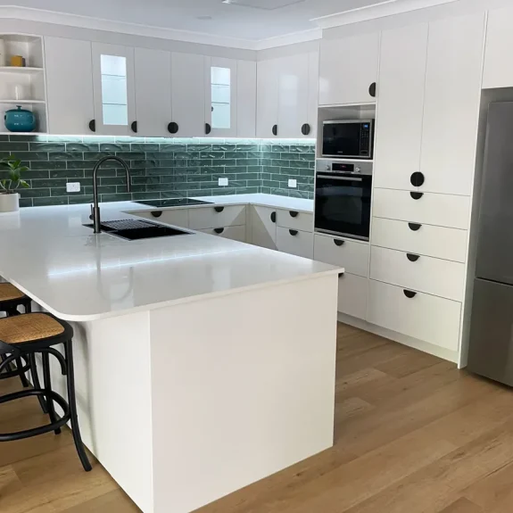Classic White Sheen Cabinetry & Doors. This kitchen space effortlessly combines elegance and functionality. Built and installed by Gecko Kitchens.