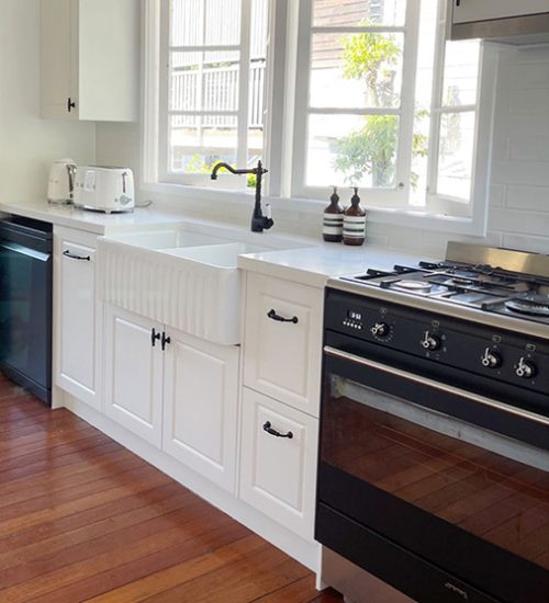 White Kitchen with Double Farmhouse Sink Kitchen renovation custom designed with farmhouse sink and built by Gecko Kitchens, kitchen builder in Kedron, Brisbane.