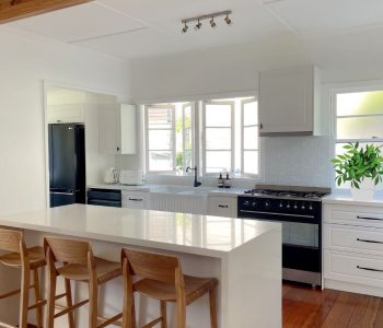 Kitchen renovation in white cabinetry and new kitchen bench custom designed & installed by Gecko Kitchens in Brisbane.