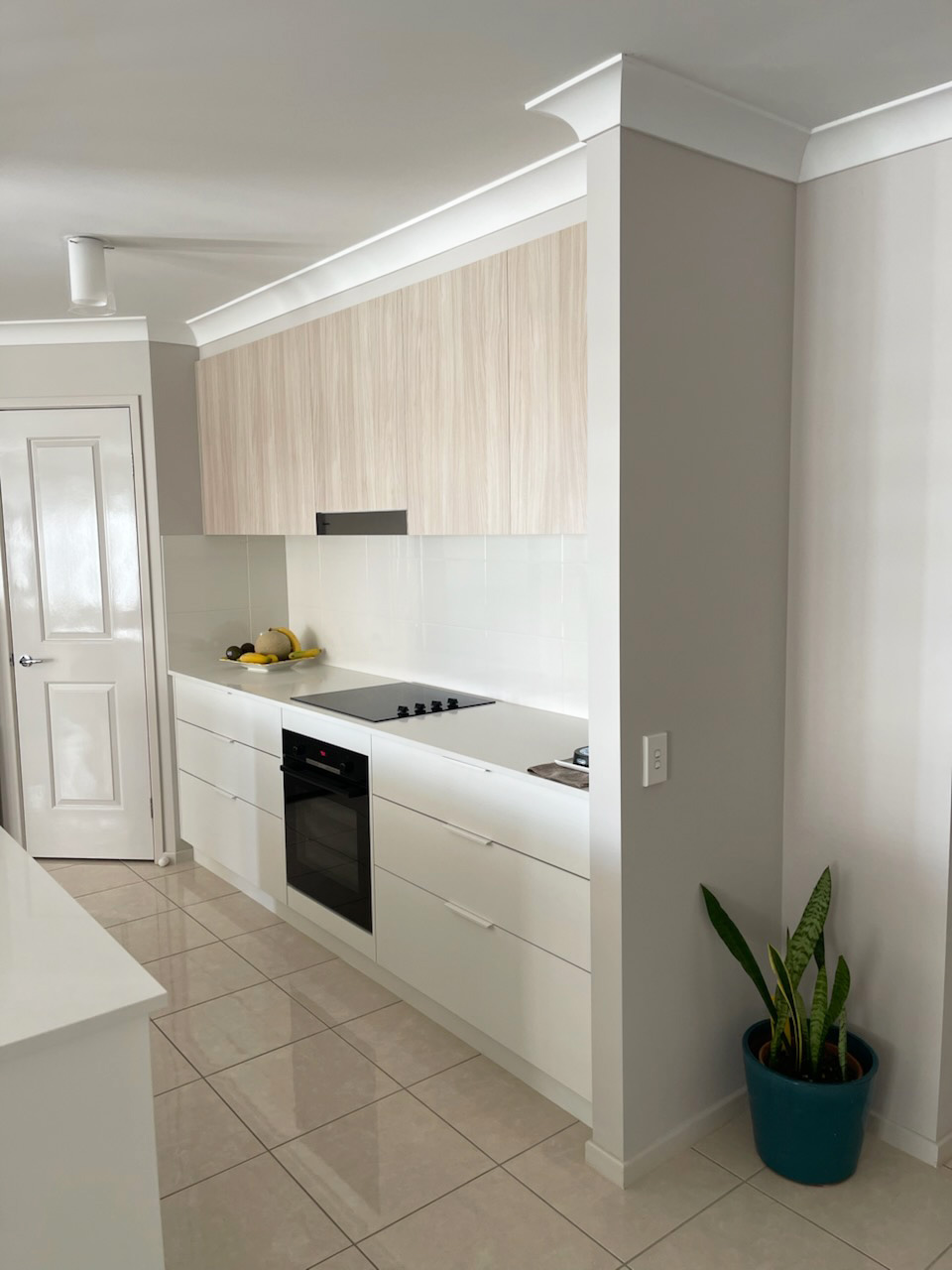 Polytec Classic White Matt cabinetry complemented by Soft Walnut timber doors, and YDL Stone benchtops 1