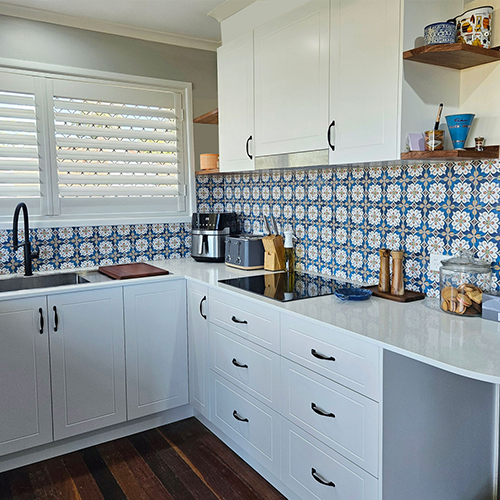 Kitchen renovation with white cabinetry, blue and white tiles by expert kitchen renovator Gecko Kitchens in Kedron, Brisbane.
