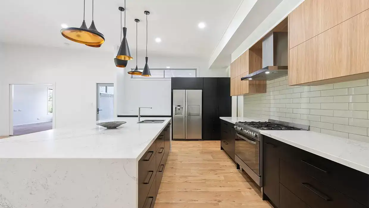 Beautiful Island benchtop, kitchen cabinety with stone benchtop by Gecko Kitchens