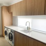 Laundry renovation with hanging space, ample storage, loads of bench spaced. Gecko Kitchens did this job for Reno Revival builders.