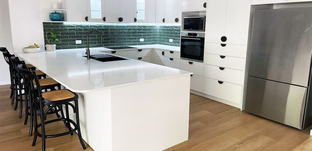 White kitchen renovation with emerald green tiles installed by Gecko Kitchens, Kedron Brisbane.