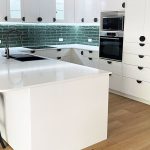 White kitchen renovation with emerald green tiles installed by Gecko Kitchens, Kedron Brisbane.
